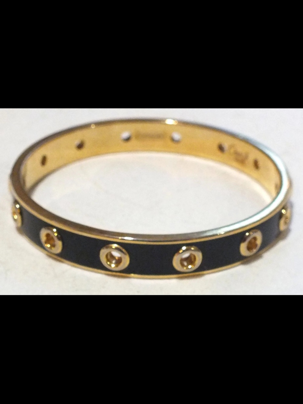 Coach gold tone and black enamel bracelet